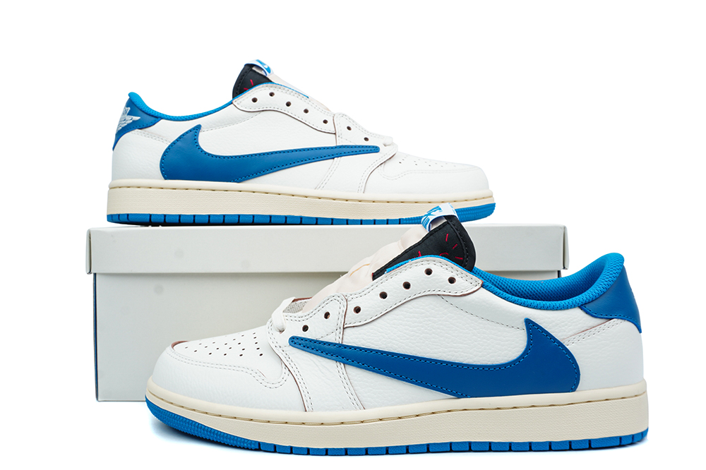 Side view of a pair of sail and blue Travis Scott Jordan 1s.